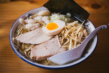 Savor the taste of authentic Japanese ramen with pork, egg, and fresh toppings in a warm broth. HD wallpaper