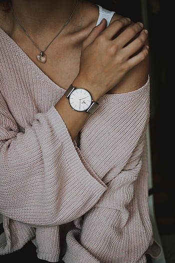 Chic fashion portrait of woman in cozy sweater showcasing stylish watch and necklace. HD phone wallpaper