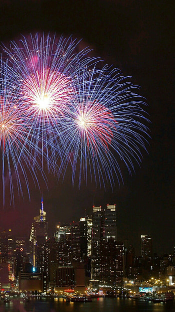 Fireworks extravaganza, New Year's celebration, Vibrant colors, Joyful moments HD phone wallpaper
