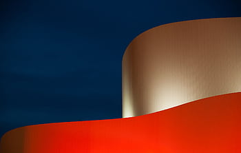 Abstract architectural featuring bold colors and modern curves against a dark sky. HD wallpaper