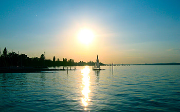 Sunset and the Sailboat, colors, pier, beautiful, sailboat, lakes, reflection, nature, sky, clear, sunset HD wallpaper