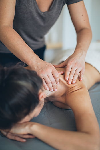 A soothing massage therapy session focused on relaxation and wellness indoors. HD phone wallpaper