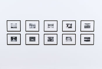 Simple and elegant wall display with black and white framed graphs in a modern interior. HD wallpaper