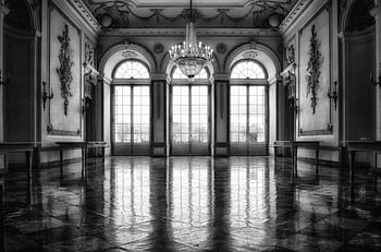 Black and white of a baroque interior with a chandelier and large windows. HD wallpaper