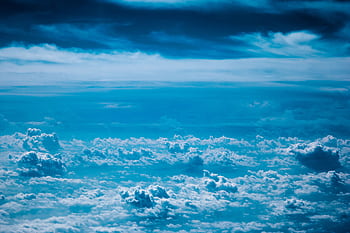 Stunning aerial graph of a vast blue sky and cloudscape, perfect for backgrounds or themes of serenity. HD wallpaper