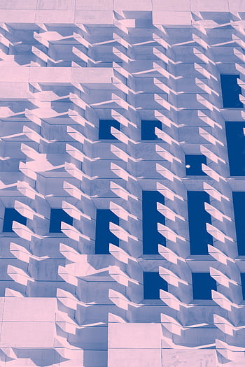 Abstract geometric facade with striking shadows in a modern architectural design. HD phone wallpaper