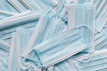 A collection of blue disposable masks for medical and hygiene use. HD wallpaper