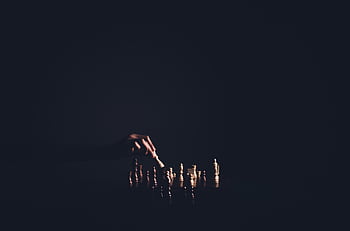 Dark atmospheric chess game showcasing strategic play, emphasizing intelligence and strategy. HD wallpaper