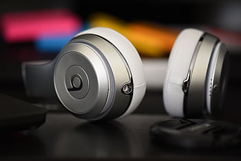 A detailed shot of sleek over-ear heads, perfect for music lovers and audiophiles. HD wallpaper
