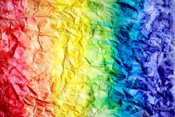 Bright and colorful rainbow gradient on crumpled paper texture, perfect for backgrounds. HD wallpaper