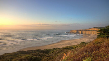 sand cliffs on a beautiful beach, sea, waves, sand, cliffs, grass, beach HD wallpaper