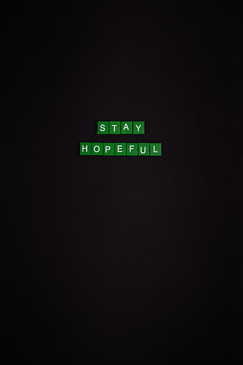 Black background with green Scrabble tiles spelling 'Stay Hopeful' for a minimalist, motivational scene. HD phone wallpaper