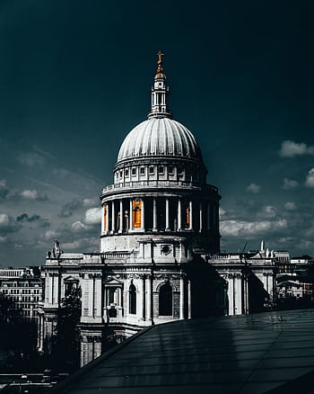 A striking view of St Paul's Cathedral under a dramatic sky in London. HD phone wallpaper