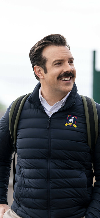 Ted Lasso TV show, Heartwarming comedy, Unexpected friendship, Humorous dialogue HD phone wallpaper