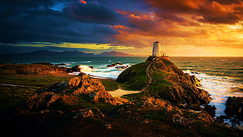 Lighthouse in Wales, UK, sea, shore, colors, clouds, newborough, sky, rhosyr, sunset, rocks HD wallpaper