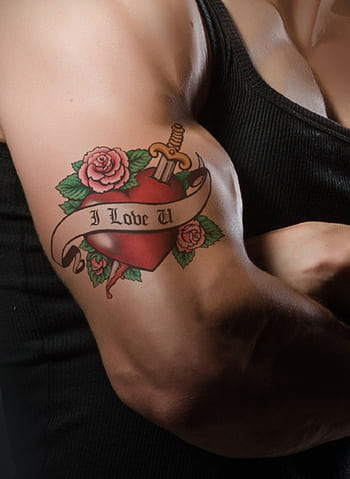 Close-up of a muscular arm with a heart and rose tattoo symbolizing love and strength. HD phone wallpaper