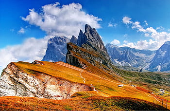Breathtaking view of the Dolomites with vibrant autumn colors and crisp skies. HD wallpaper
