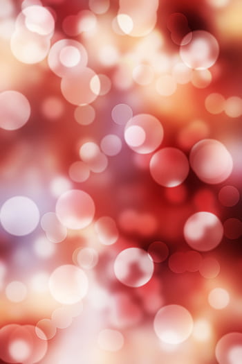A dynamic red bokeh background with bright circles and blurred patterns. HD phone wallpaper