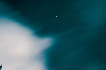 A mesmerizing view of the night sky with clouds and stars in Karachi, Pakistan. HD wallpaper