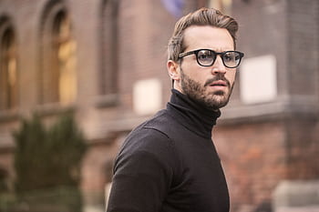 A fashionable man with glasses and a beard captured outdoors in Budapest. HD wallpaper