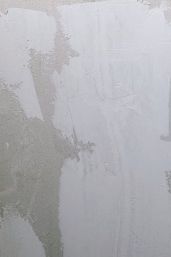 A minimalist grunge-style cement wall showcasing texture and subtle patterns. HD phone wallpaper
