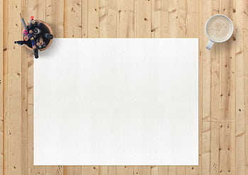 Flat lay of art supplies, blank paper, and coffee on a wooden desk for a creative workspace. HD wallpaper
