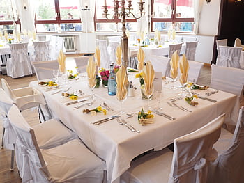 A beautifully decorated dining room table set for an elegant celebration indoors. HD wallpaper