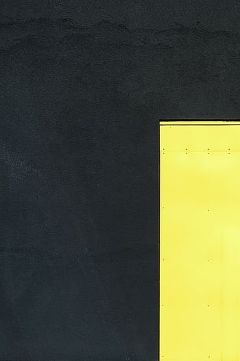 A geometric composition with a bright yellow panel against a dark wall showcasing minimalist architecture. HD phone wallpaper