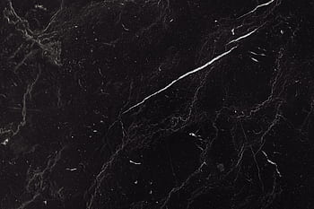 Sophisticated black marble texture with natural veining ideal for backgrounds and design projects. HD wallpaper