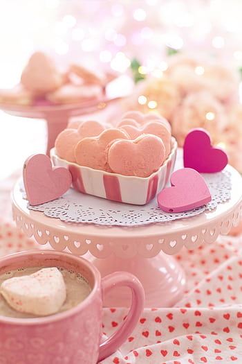 Indulge in heart-shaped pink macarons on a romantic Valentine's Day setting. HD phone wallpaper