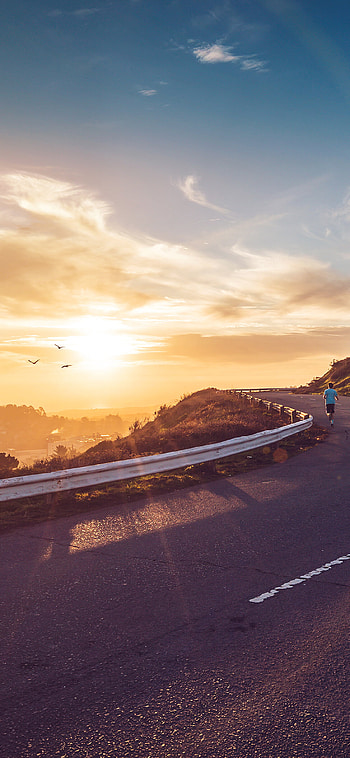 Morning runner, Mountain jogging, Sun's embrace, Nature's tranquility HD phone wallpaper