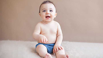Smiling Cute Little Toddler Boy Is Sitting On White Fur Cloth Wearing Blue Trouser Cute HD wallpaper