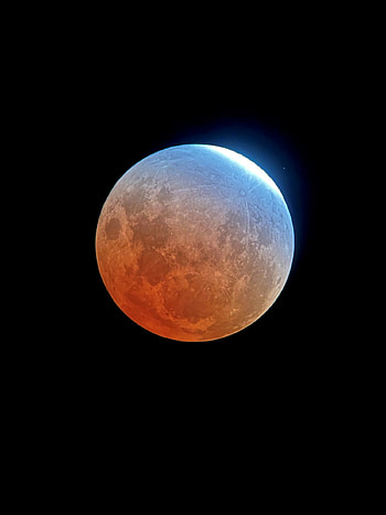 Captivating lunar eclipse in Houston, Astronomical beauty, Celestial enchantment, Sky's celestial show HD phone wallpaper