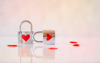 Two silver padlocks with heart designs symbolize love and connection. HD wallpaper