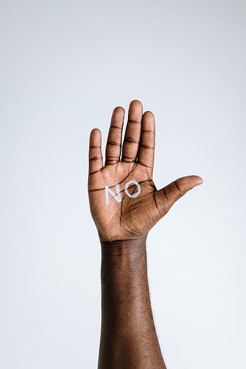 A hand with the word 'No' written on the palm, symbolizing refusal or denial. HD phone wallpaper