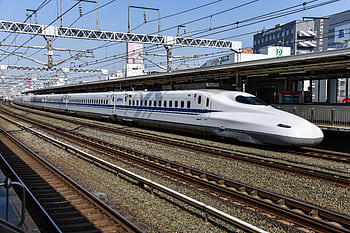 A high-speed bullet train at Hamamatsu Station in Shizuoka, Japan, showcasing modern rail transport. HD wallpaper