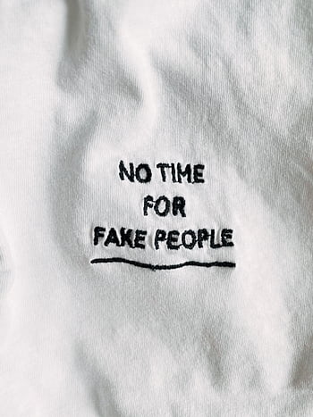 White fabric with black embroidered text 'No Time For Fake People'. HD phone wallpaper