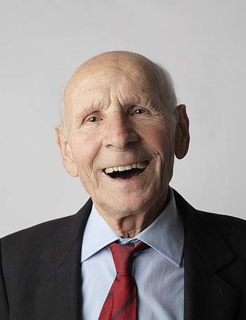 A smiling elderly man in a suit and tie, conveying happiness and wisdom. HD phone wallpaper