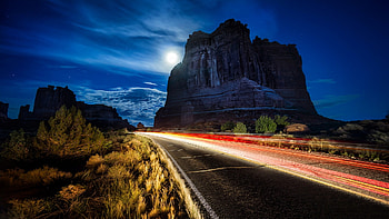 lights in slow exposure on a desert highway, night, slow exposure, moon, lights, desert, highway HD wallpaper
