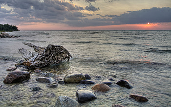 Sunset from McGregor Point, rocky, beaches, beautiful, twilight, driftwood, clouds, nature, calm, sunset, ocean HD wallpaper