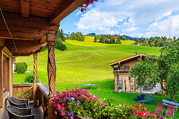 Kirchberg Village, Austria, spring, balcony, greenery, Austria, chalet, hills, slope, que, house, beautiful, grass, Europe, mountain, cabin, flowers, cottage, village HD wallpaper