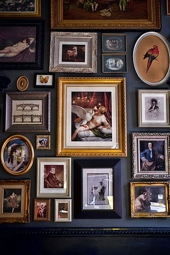 Discover a vibrant collection of framed art pieces elegantly displayed on a wall, showcasing diverse designs and sizes. HD phone wallpaper