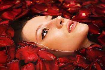 In a water bed of roses...., lady, red, eyes, face, rose petals, lips, water HD wallpaper