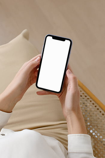 Woman holding smart with blank screen for mockup or design purposes, ideal for advertising. HD phone wallpaper