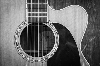 Detailed black and white of an acoustic guitar showcasing strings and sound hole. HD wallpaper