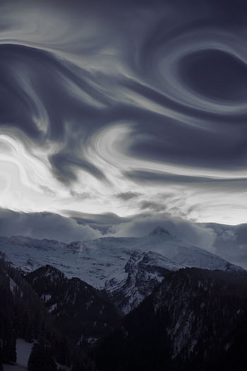 Stunning view of swirling clouds above snow-covered peaks in Trentino-Südtirol, Italy. HD phone wallpaper