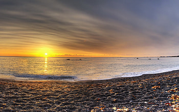 sunset on pebble beach r, sea, pebbles, r, sunset, beach HD wallpaper