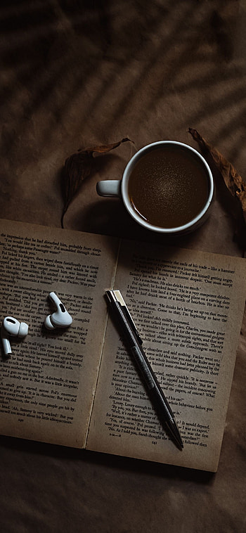 Caffeine-fueled reading, Coffee stains, Musical accompaniment, Book lovers' bliss HD phone wallpaper
