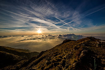 Breathtaking sunrise over mountains with dramatic clouds and clear sky. HD wallpaper