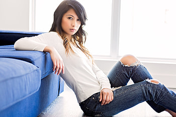 Torn jeans, leaning to sofa, girl model HD wallpaper